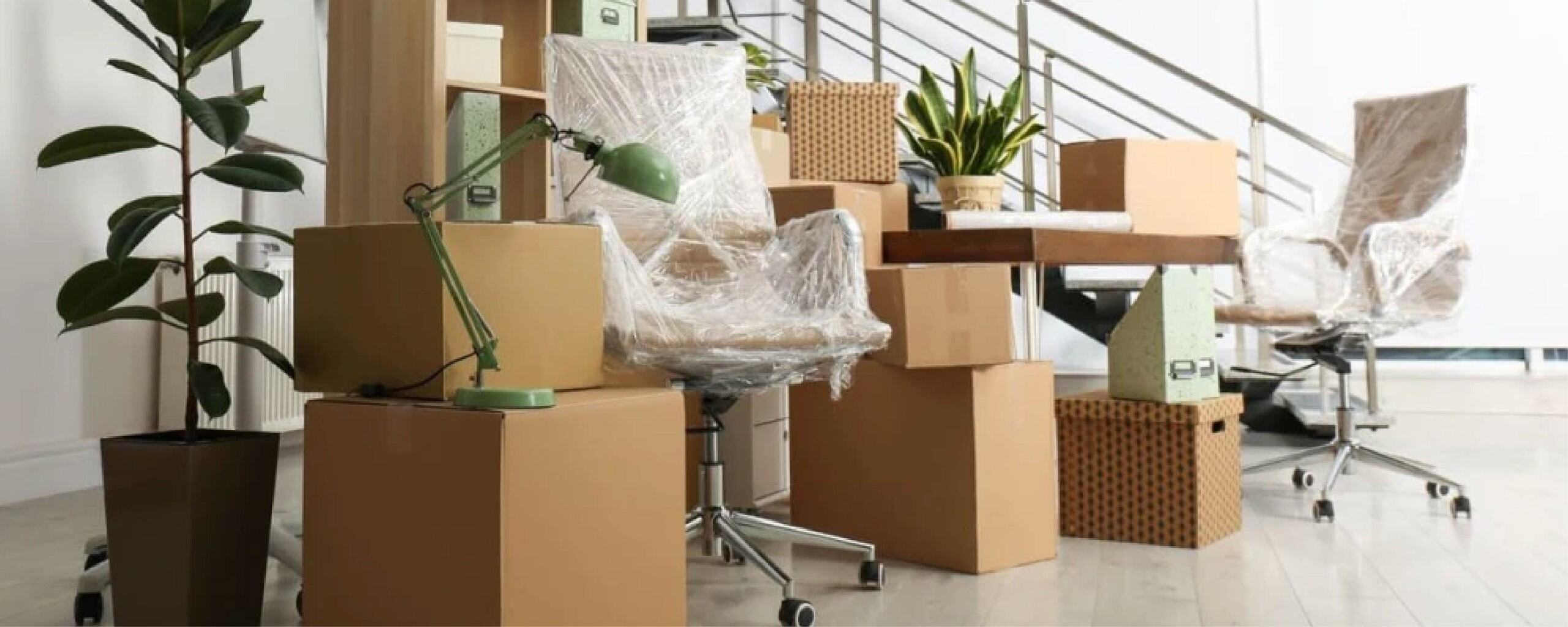 Neatly wrapped office equipment inside a business storage unit