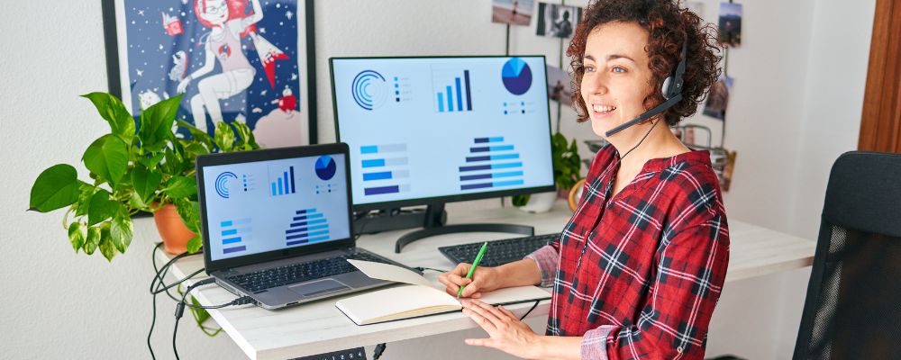 A-woman-at-work-at-their-home-office-desk-on-a-call