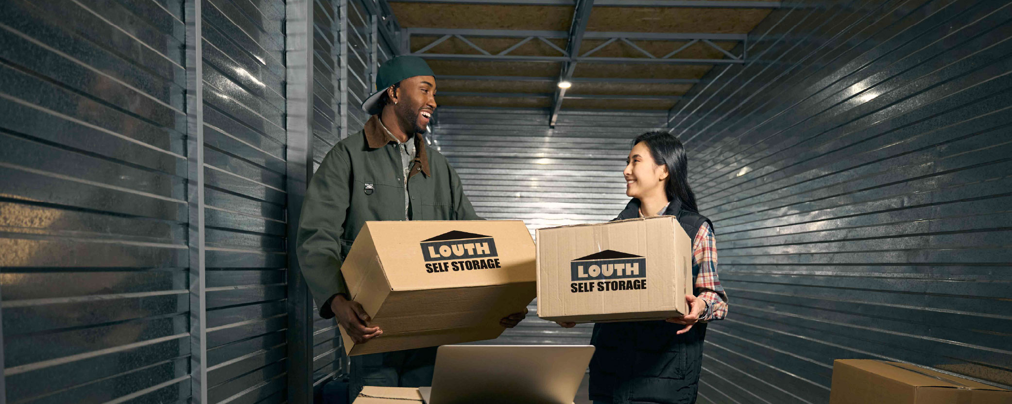 A couple moving their personal belongings into a Louth unit