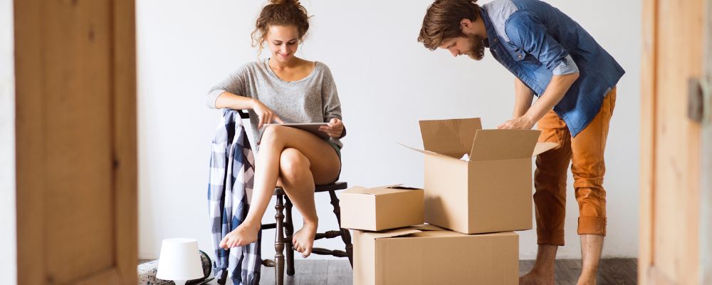 Couple packing their bedroom