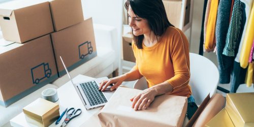 lady with laptop and box